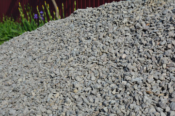 Close-up on a rock stone gravel pile at the construction site.