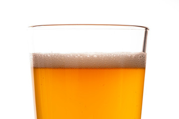 glass of beer with foam isolated on white