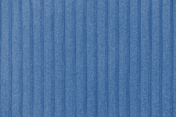 Plisse background  toned in trendy color 2020 year classic blue. geometric cloth lines. Fabric, textile close up.