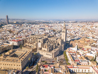 Fototapeta na wymiar Aerial view of Cathedral of Seville. Roman Catholic cathedral registered in 1987 by UNESCO as a World Heritage Site.The third-largest church in the world. Columbus an his sun are buried here.