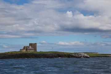 The old lighthouse and cottage on Brownsman Island in the Farne Islands Northumberland UK