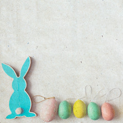 Blue wooden flat easter bunny lies on a white background. Copy space