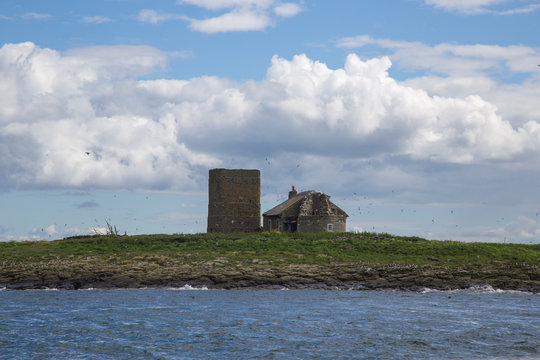 The old lighthouse and cottage on Brownsman Island in the Farne Islands Northumberland UK