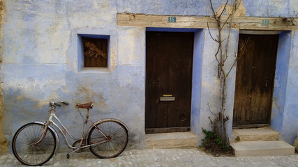 Fototapeta na wymiar Facade with bicycle in a village