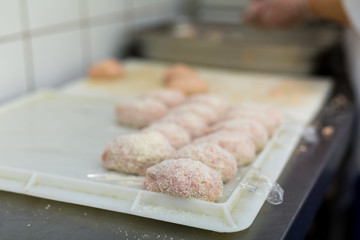 Preparation of patties of meat.