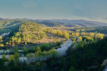 Narrow river between the green mountains