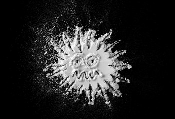 Coronavirus white powder symbol isolated on black background and texture