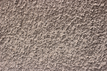 Stucco texture grey plaster background, cracked and textured cement