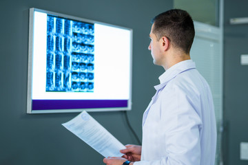 Doctor looking at x-ray in a hospital. Medical and health care concept.