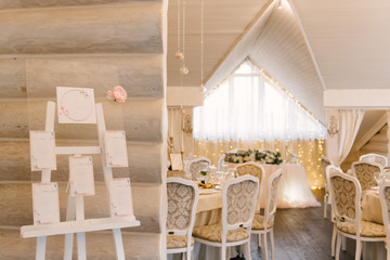 Wedding printing: rustic Seating scheme on glass with cards on a white wooden frame, copy spase