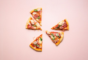 Pizza prosciutto slices on pink background. Italian  popular food