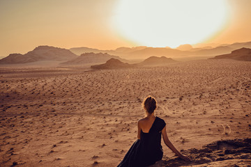 Outdoor Adventure. Sunset desert. Traveler explore world. Woman journey. Freedom travel. Luxury holidays. Active lifestyle. Harmony concept. Copy space. Wadi Rum landscape. Jordan tourism vacation