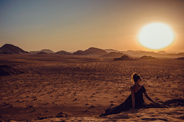 Outdoor Adventure. Sunset desert. Traveler explore world. Woman journey. Freedom travel. Luxury holidays. Harmony concept. Copy space. Wadi Rum landscape. Jordan tourism. Exotic summer vacation