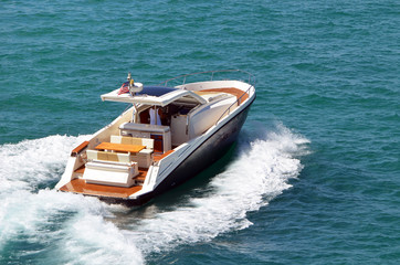 Fototapeta premium Angled overhead view of an upscale cabin cruiser on the Florida Intra-Coastal Waterway off Miami Beach.