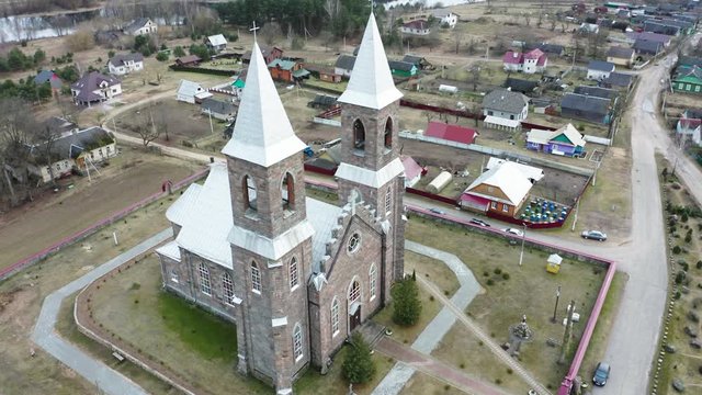 Drone shot on Catholic church of St. Iosif in Rubegevich, Belarus. Aerial view on catholic church architecture.