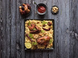 Festive dish with baked chicken and rice. Mandi Kabsa, Yemenis style