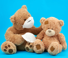 a large teddy bear in a white mask transfers the accessory to another