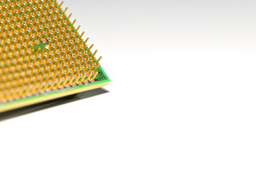 Corner of central processor unit. Golden pins of a core. Copy space. Shallow depth of field.