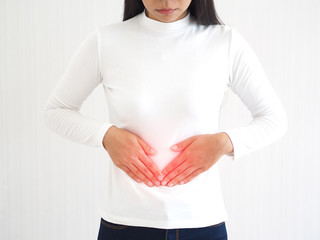 appendicitis and constipation, including gastroenteritis in asian woman and she touching her...