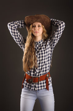 Portrait of a beautiful woman in a cowboy hat