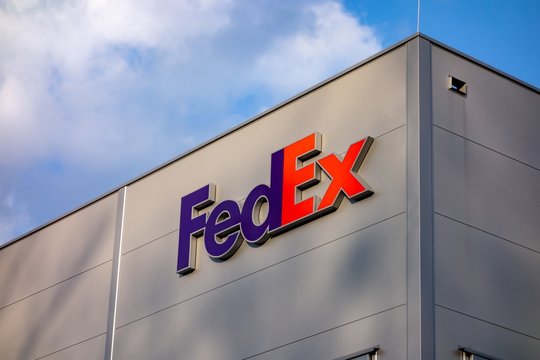 The warehouse of the FedEx multinational delivery company in Ostrava-Poruba with a logo in a  sunny day