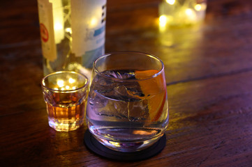 Glass of gin with tonic water, orange and ice