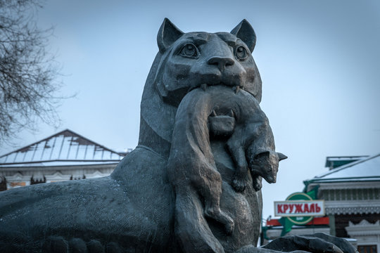 IRKUTSK, RUSSIA - FEBUARY 26, 2020 : Babr Sculpture siberian tiger symbol of Irkutsk city by winter. Irkoutsk is the capital of Siberia in Russia.