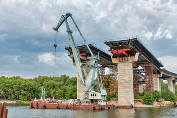 Building Preobrazhensky bridge over the Dnieper river in Zaporizhia, Ukraine.