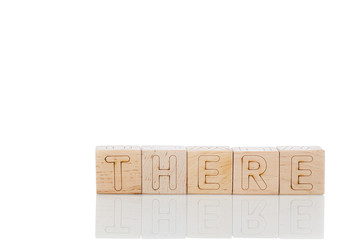Wooden cubes with letters there on a white background