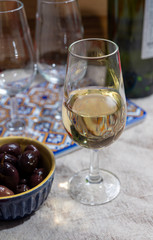 Fortified wine from Andalusia, Spain, different types of sherry in glasses and olives, colors of Andalusisa