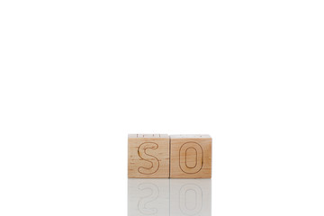 Wooden cubes with letters so on a white background