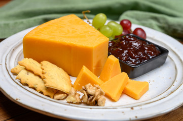 Cheese collection, yellow matured cheddar cheese triangle piece from England