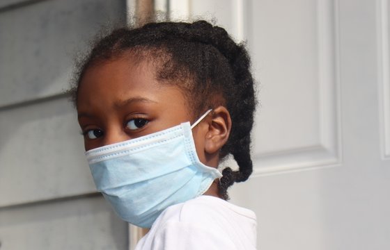 Girl Wearing Blue Surgical Mask Outside House