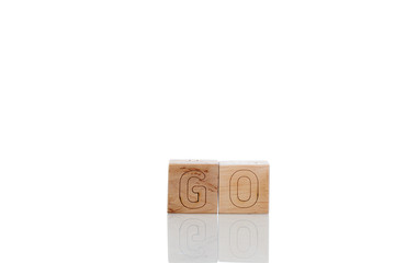 Wooden cubes with letters go on a white background