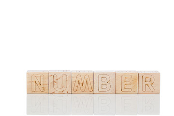 Wooden cubes with letters number on a white background