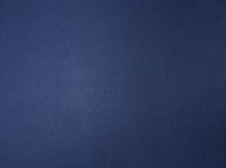 Dark blue metallic textured background with a gradient.