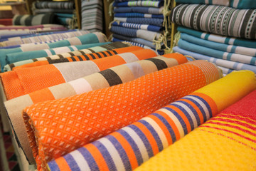 Colorful Tunisian fouta beach towels on display in a shop