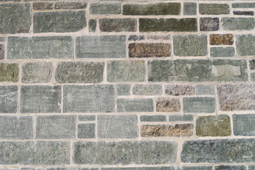 Textured stone wall of a modern castle