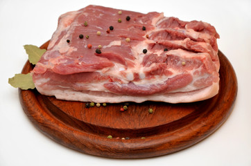 pork bacon on a wooden board piece of raw meat on a white background 