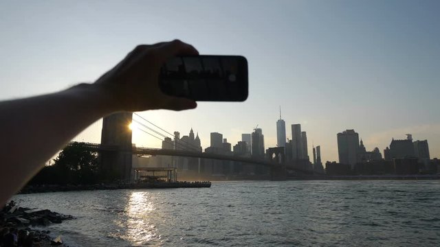 POV on Tourist Photographing Brooklyn Bridge in NYC in 4K Slow motion 60fps