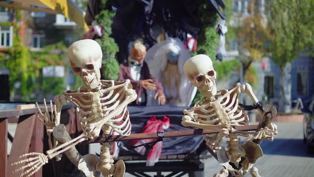 Halloween, Two Skeletons Drawn in a Sled Pull Carriage with The Corpses of a Bride and A Bride