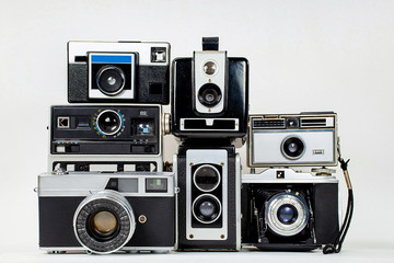 collection of retro cameras on isolated background