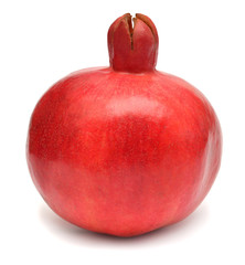 One pomegranate fruit isolated on a white background. Depth of field throughout the photo
