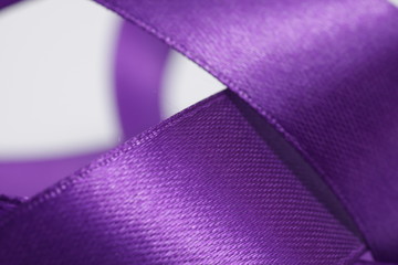 Abstract defocused purple satin ribbon for background