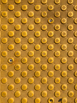 Yellow blind crosswalk pattern sidewalk