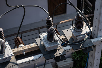 Top view of High voltage power transformer with electrical insulation and electrical equipment in...