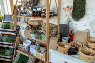 Glass vials and jars filled with dried herbs