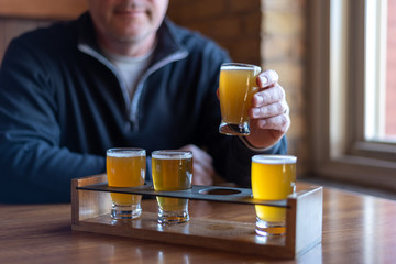 Man sampling craft beer at a restaurant