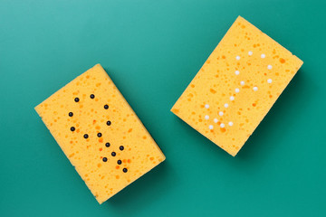 Abstract signs of man and woman made by needles in sponges for washing dishes, the concept of...