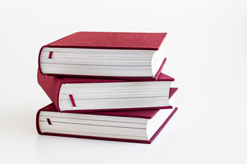 Cloth hardcover book,coated paper with hard cover books stacked on the white background.